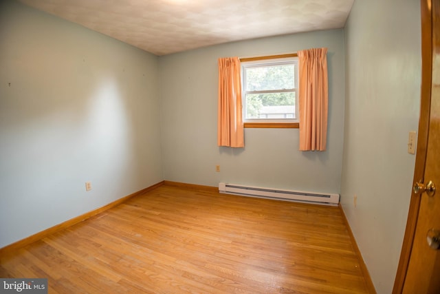 529 Appalachian Ave, Mechanicsburg, PA 17055 - spare room with a baseboard radiator, light wood-style flooring, and baseboards