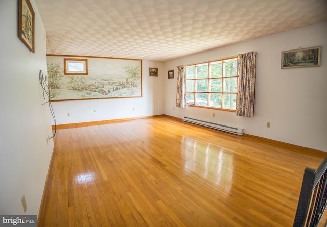 529 Appalachian Ave, Mechanicsburg, PA 17055 - spare room with baseboard heating, hardwood / wood-style floors, and baseboards