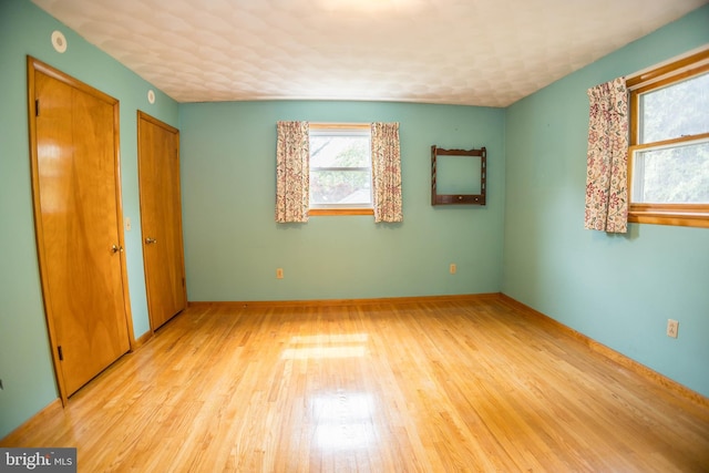 529 Appalachian Ave, Mechanicsburg, PA 17055 - unfurnished bedroom featuring two closets, light wood-style floors, and baseboards