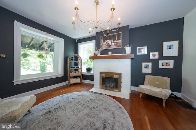 122 Webster Ave, Wyncote, PA 19095 - sitting room with a chandelier, wood finished floors, baseboards, and a fireplace