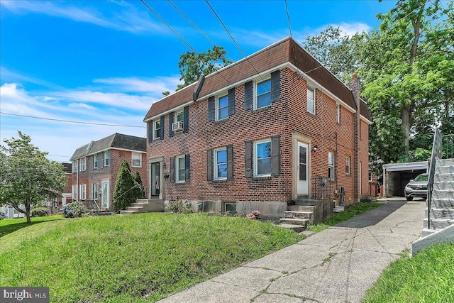 1240 Harding Dr, Havertown, PA 19083 - view of front of home featuring a front lawn, a chimney, and brick siding
