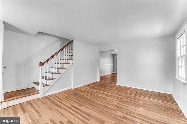 1240 Harding Dr, Havertown, PA 19083 - unfurnished living room featuring light wood finished floors and stairway