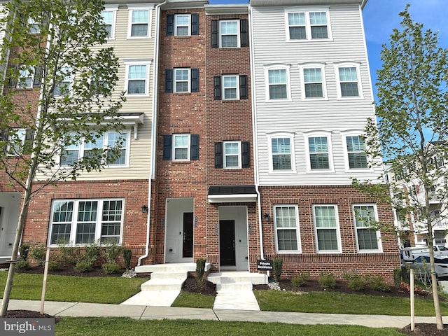 9402 James Macgowan Ln Unit 611, Owings Mills, MD 21117 - view of property with brick siding