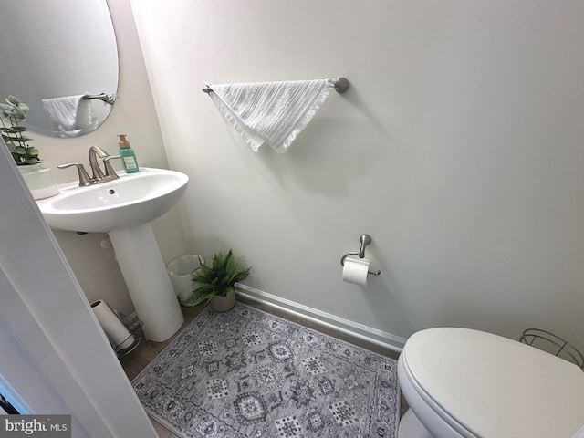 9402 James Macgowan Ln Unit 611, Owings Mills, MD 21117 - bathroom with toilet and baseboards