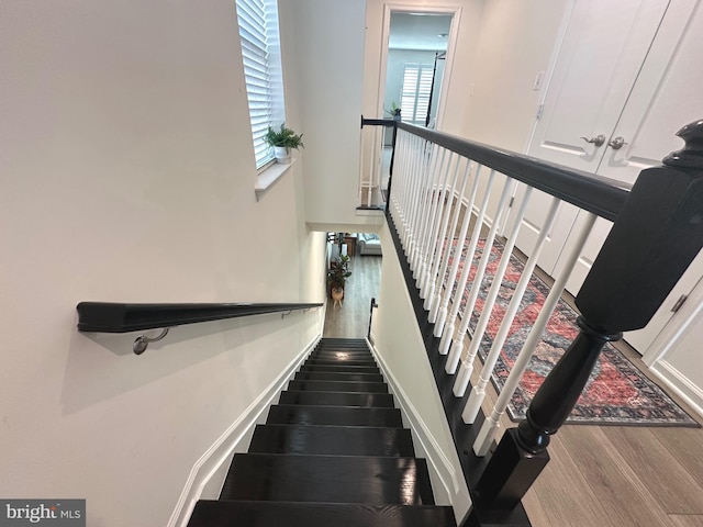 9402 James Macgowan Ln Unit 611, Owings Mills, MD 21117 - staircase with wood finished floors and a towering ceiling