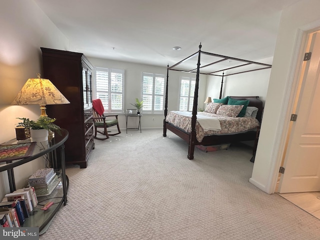 9402 James Macgowan Ln Unit 611, Owings Mills, MD 21117 - bedroom featuring light carpet and baseboards