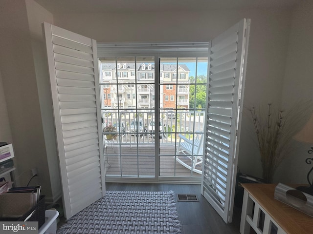 9402 James Macgowan Ln Unit 611, Owings Mills, MD 21117 - doorway to outside with wood finished floors