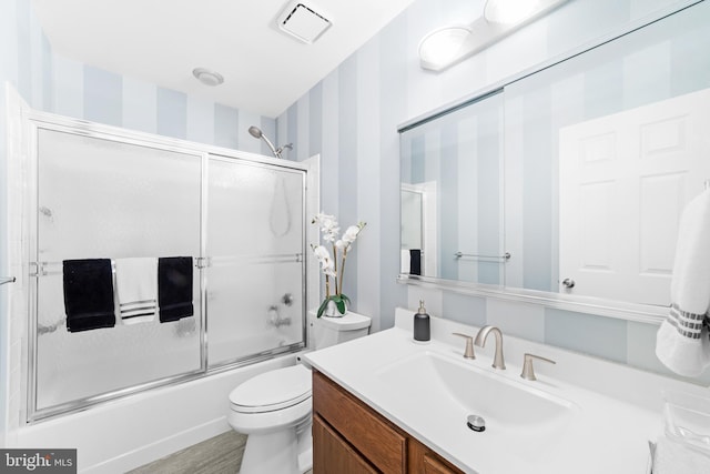 738 Prospect Rd, Monroe Township, NJ 08831 - full bath with vanity, toilet, enclosed tub / shower combo, and wallpapered walls