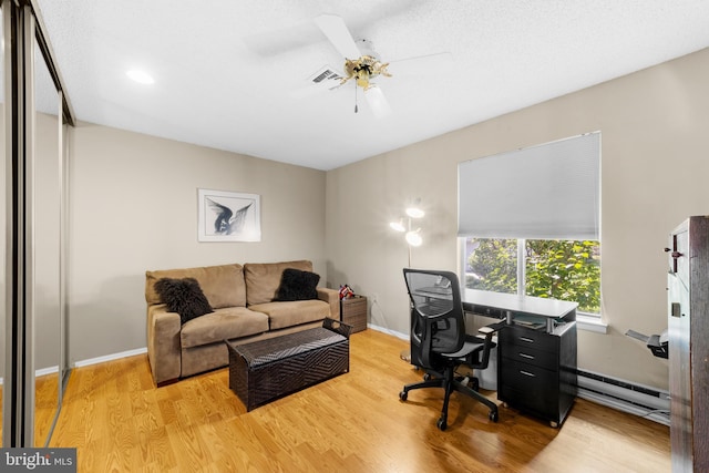 738 Prospect Rd, Monroe Township, NJ 08831 - office space featuring a baseboard heating unit, wood finished floors, a ceiling fan, and baseboards