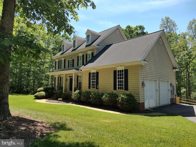 8602 General Sykes Cir, Fredericksburg, VA 22407 - view of front of home with a front yard, covered porch, a shingled roof, and asphalt driveway