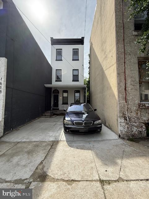 1620 N 26th St, Philadelphia, PA 19121 - view of property featuring stucco siding and covered porch