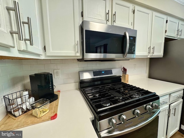 6820 Jade Ct, Capitol Heights, MD 20743 - kitchen with stainless steel appliances, light countertops, tasteful backsplash, and white cabinets