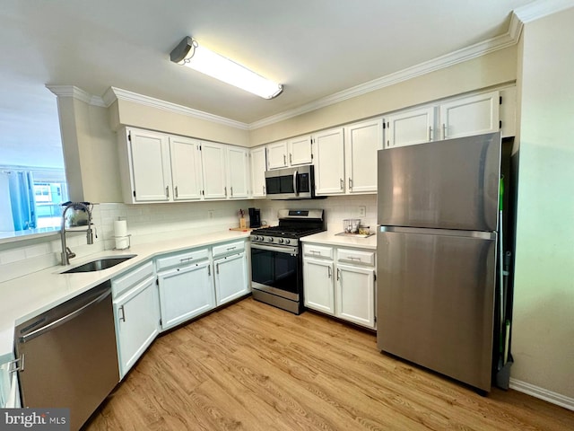 6820 Jade Ct, Capitol Heights, MD 20743 - kitchen with stainless steel appliances, crown molding, tasteful backsplash, light wood-type flooring, and light countertops
