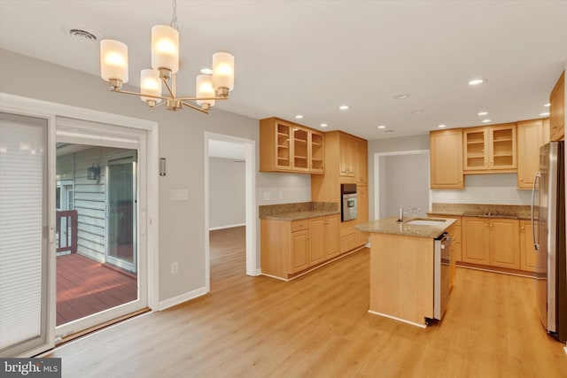 1216 Steamboat Rd, Shady Side, MD 20764 - kitchen featuring stainless steel appliances, a center island with sink, light wood-style floors, light stone countertops, and recessed lighting