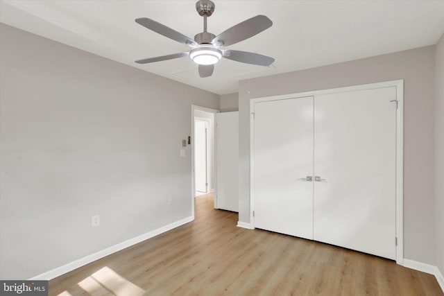 1216 Steamboat Rd, Shady Side, MD 20764 - unfurnished bedroom with wood finished floors, a closet, and a ceiling fan