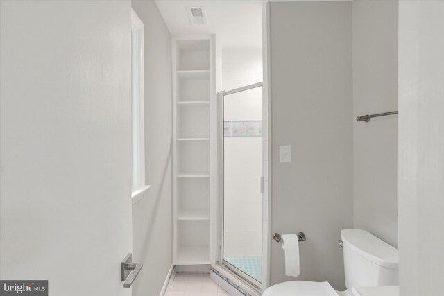 1216 Steamboat Rd, Shady Side, MD 20764 - full bathroom featuring a shower stall, a walk in closet, and tile patterned floors