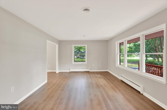 1216 Steamboat Rd, Shady Side, MD 20764 - spare room featuring baseboard heating, a baseboard radiator, and light wood-type flooring