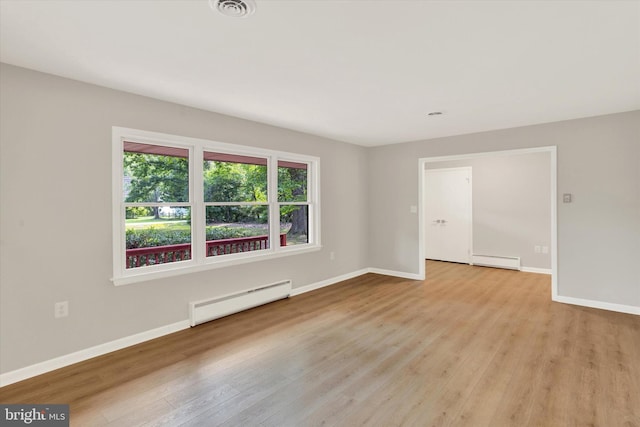 1216 Steamboat Rd, Shady Side, MD 20764 - unfurnished room with baseboard heating, a baseboard radiator, and light wood finished floors