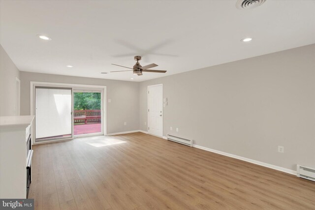 1216 Steamboat Rd, Shady Side, MD 20764 - unfurnished living room with baseboard heating, ceiling fan, light wood-type flooring, recessed lighting, and a baseboard heating unit