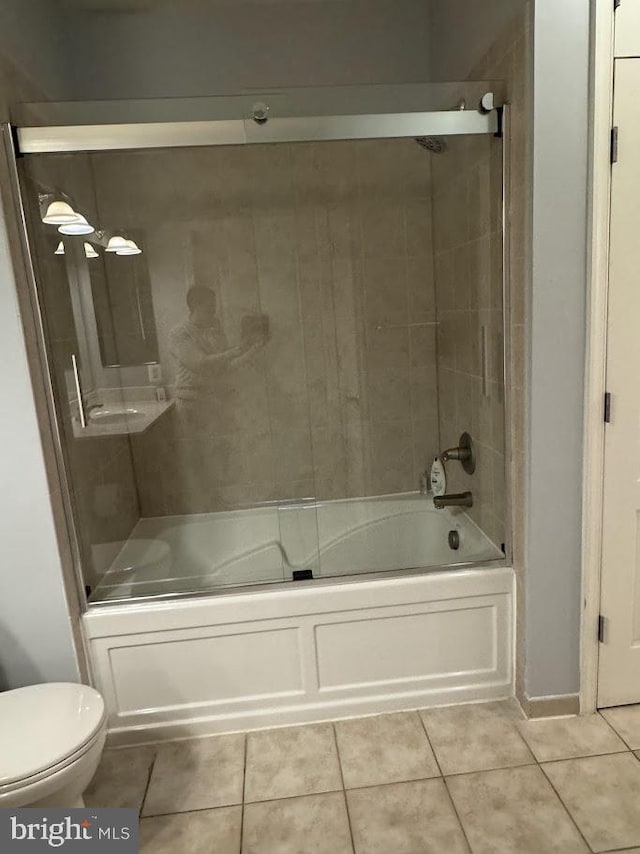 1451 Belmont St NW Unit 202, Washington, DC 20009 - bathroom with tile patterned flooring, toilet, and enclosed tub / shower combo