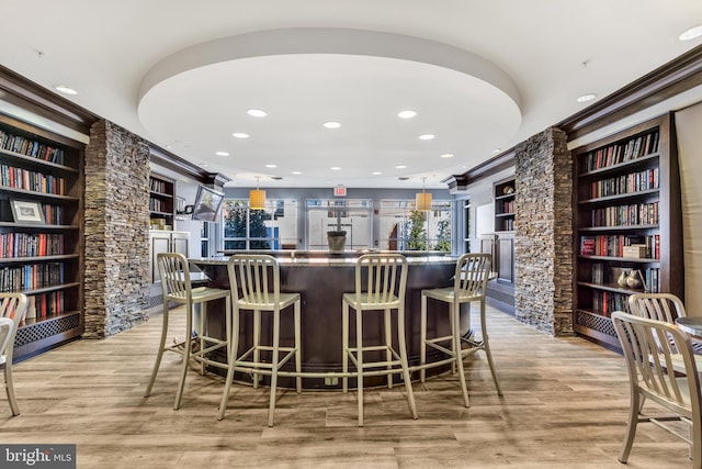 1451 Belmont St NW Unit 202, Washington, DC 20009 - community bar area with recessed lighting, a stone fireplace, built in shelves, light wood-style flooring, and plenty of natural light