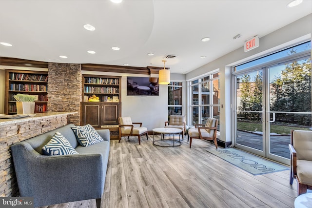 1451 Belmont St NW Unit 202, Washington, DC 20009 - sitting room with light wood-type flooring, recessed lighting, built in shelves, and baseboards