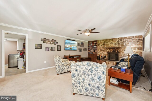 2360 Chip Pt, Warrington, PA 18976 - carpeted living area featuring washer / clothes dryer, a ceiling fan, crown molding, and a stone fireplace
