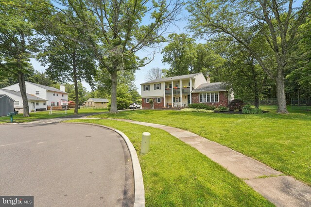 2360 Chip Pt, Warrington, PA 18976 - view of front of house with brick siding, a front lawn, and a balcony
