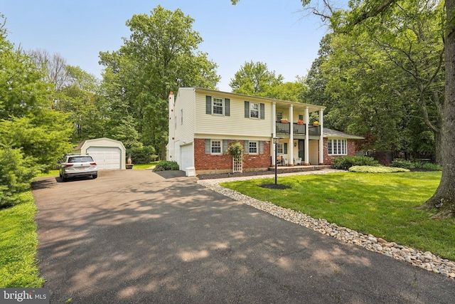 2360 Chip Pt, Warrington, PA 18976 - view of front of house with brick siding, covered porch, a front lawn, a garage, and driveway