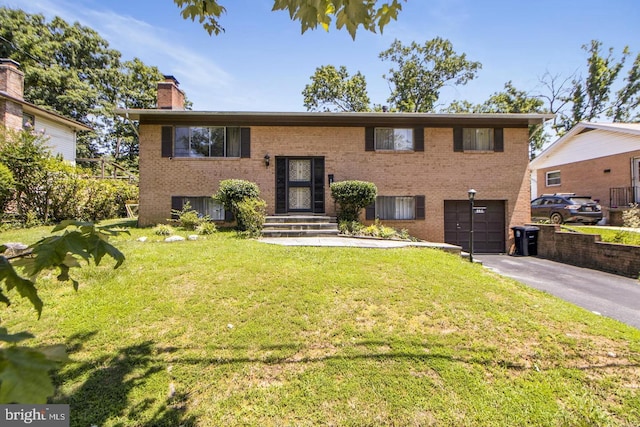 6311 Barrs Ln, Lanham, MD 20706 - bi-level home with driveway, a chimney, brick siding, a garage, and a front yard