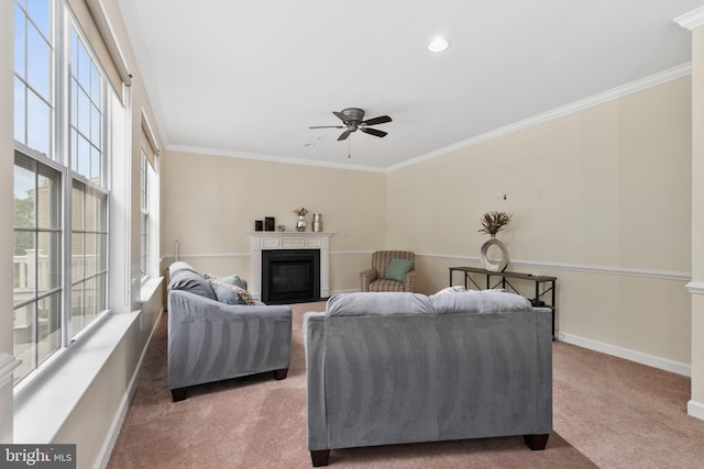 7027 Sand Cherry Way, Clinton, MD 20735 - carpeted living area with ornamental molding, a ceiling fan, a glass covered fireplace, baseboards, and recessed lighting