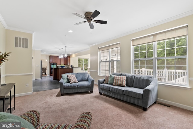 7027 Sand Cherry Way, Clinton, MD 20735 - living room with crown molding, light colored carpet, plenty of natural light, baseboards, and recessed lighting