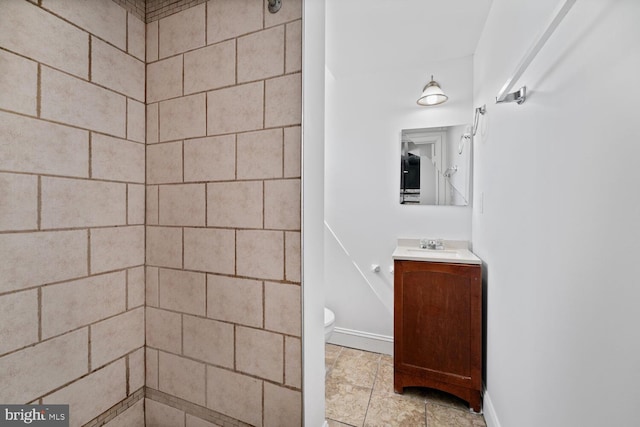 212 Division Ave NE, Washington, DC 20019 - bathroom with vanity, a tile shower, and toilet