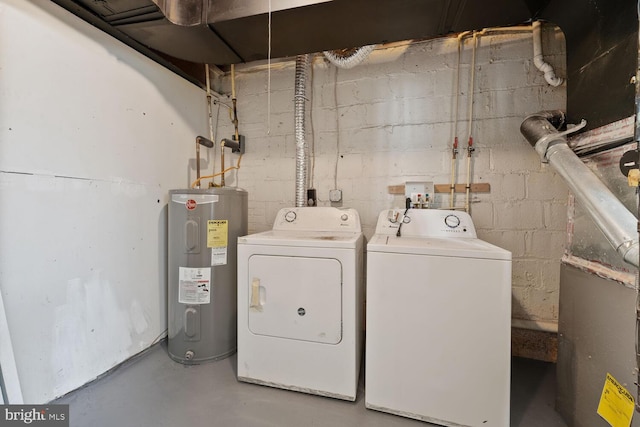 212 Division Ave NE, Washington, DC 20019 - washroom featuring electric water heater and washing machine and dryer