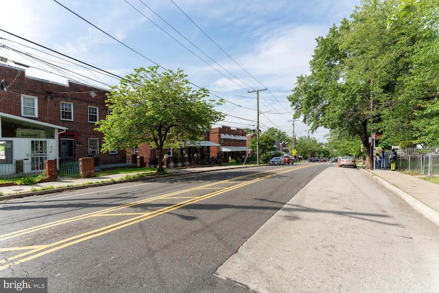212 Division Ave NE, Washington, DC 20019 - view of asphalt road featuring sidewalks, curbs, and street lights