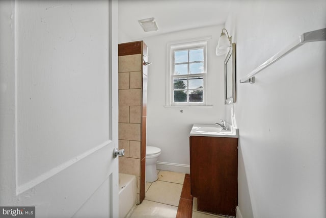 212 Division Ave NE, Washington, DC 20019 - bathroom featuring vanity, tile patterned floors, toilet, tub / shower combination, and baseboards