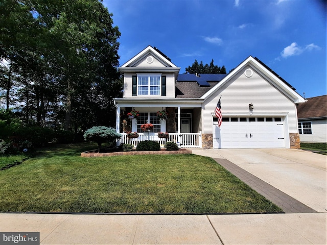63 Briarwood Dr, Little Egg Harbor Twp, NJ 08087 - traditional-style house featuring covered porch, stone siding, concrete driveway, an attached garage, and solar panels