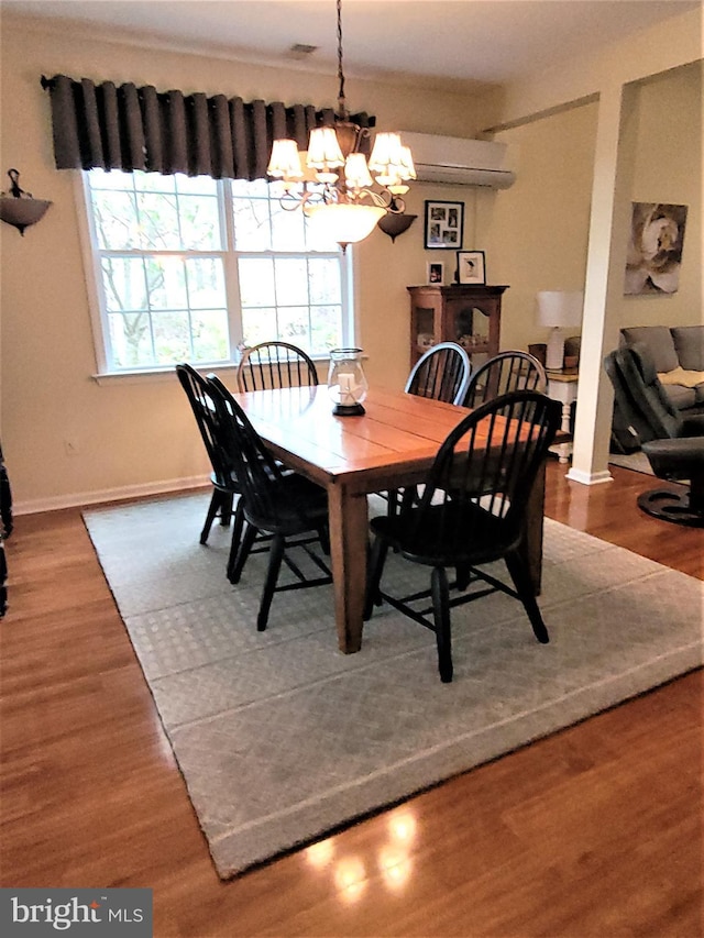 63 Briarwood Dr, Little Egg Harbor Twp, NJ 08087 - dining area featuring a chandelier, baseboards, wood finished floors, and a wall mounted AC
