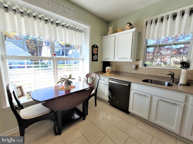 63 Briarwood Dr, Little Egg Harbor Twp, NJ 08087 - kitchen featuring black dishwasher, decorative backsplash, light tile patterned flooring, white cabinets, and light countertops