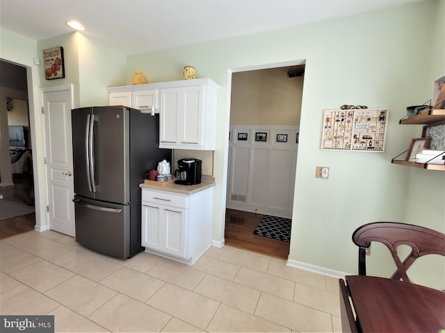 63 Briarwood Dr, Little Egg Harbor Twp, NJ 08087 - kitchen featuring freestanding refrigerator, white cabinets, light countertops, light tile patterned floors, and recessed lighting