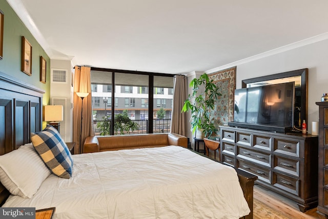 2700 Virginia Ave NW Unit 109, Washington, DC 20037 - bedroom with crown molding and wood finished floors