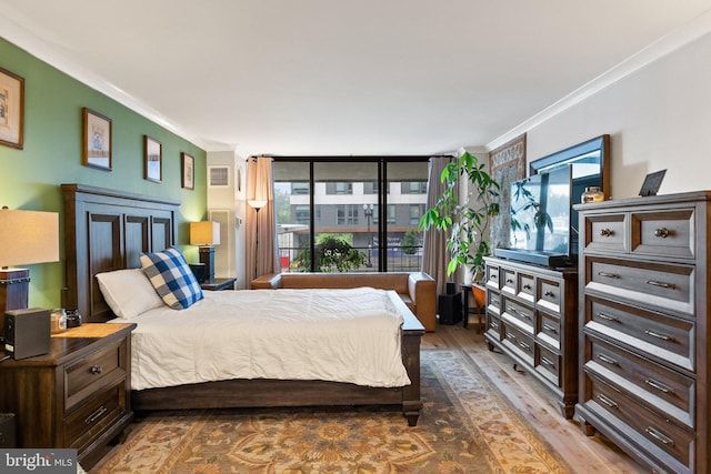 2700 Virginia Ave NW Unit 109, Washington, DC 20037 - bedroom with crown molding, wood finished floors, and multiple windows