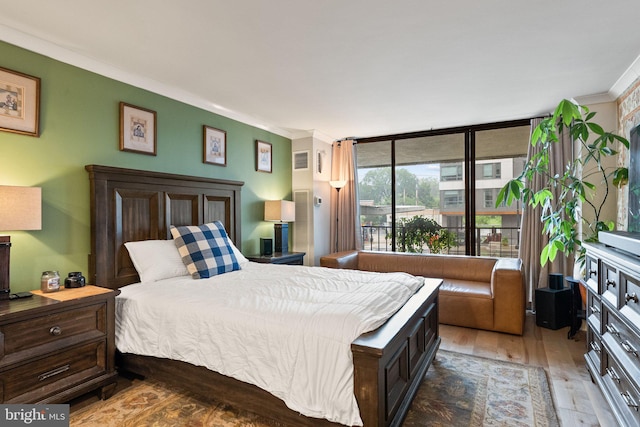 2700 Virginia Ave NW Unit 109, Washington, DC 20037 - bedroom featuring wood finished floors and ornamental molding