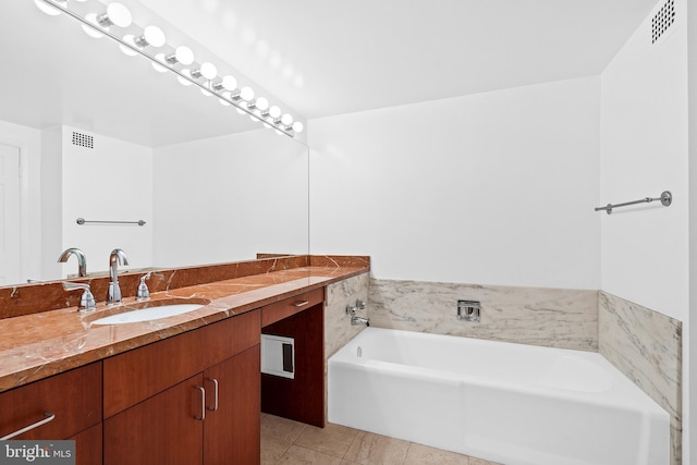 2700 Virginia Ave NW Unit 109, Washington, DC 20037 - bathroom with vanity, a garden tub, and tile patterned floors