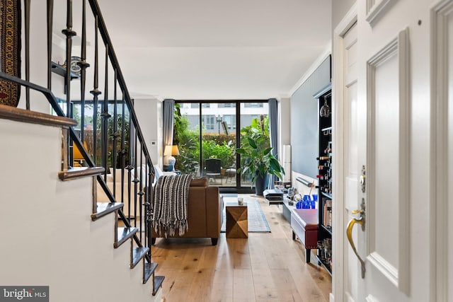 2700 Virginia Ave NW Unit 109, Washington, DC 20037 - foyer entrance featuring hardwood / wood-style flooring, stairs, and floor to ceiling windows