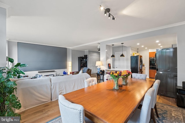 2700 Virginia Ave NW Unit 109, Washington, DC 20037 - dining space featuring wood finished floors and crown molding