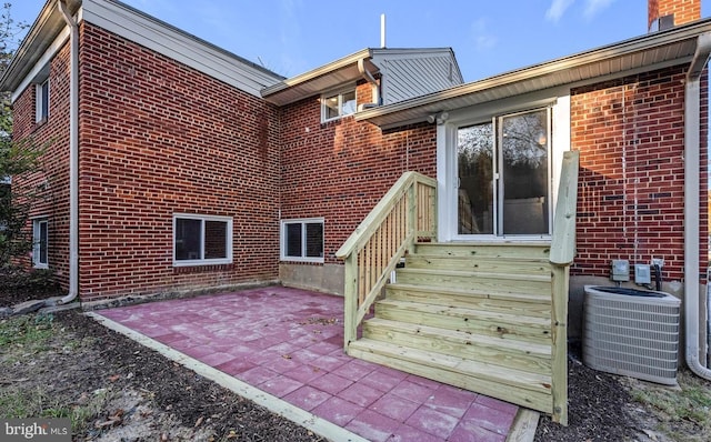 425 Saint Margarets Dr, Capitol Heights, MD 20743 - back of property with brick siding, central air condition unit, and a patio
