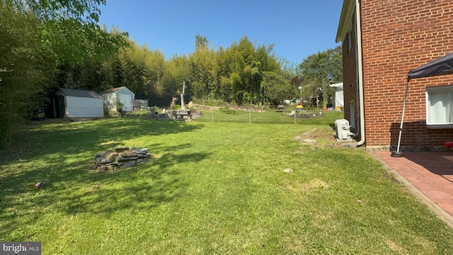 425 Saint Margarets Dr, Capitol Heights, MD 20743 - view of green lawn featuring a fire pit