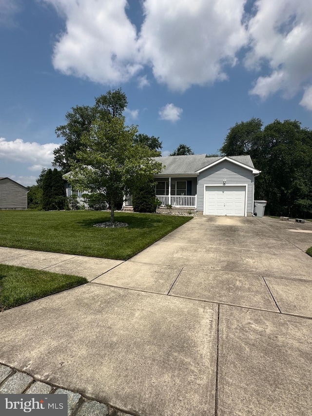 1140 Liberty Ave, Vineland, NJ 08360 - view of front of house with concrete driveway, a porch, an attached garage, and a front yard