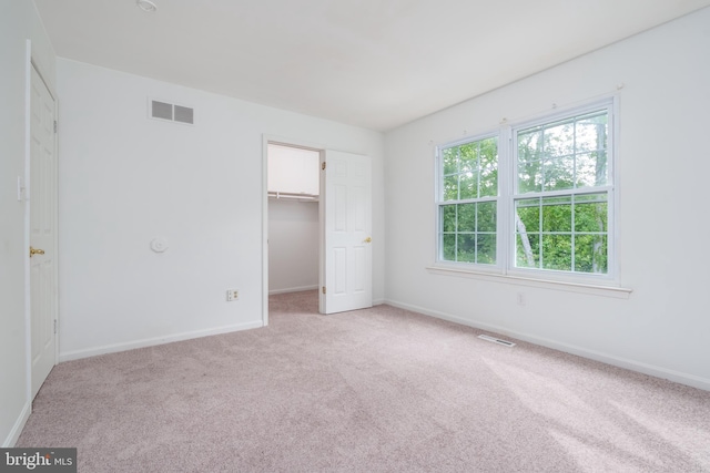 37 W Kapok, Newark, DE 19702 - unfurnished bedroom featuring carpet, baseboards, a spacious closet, and a closet